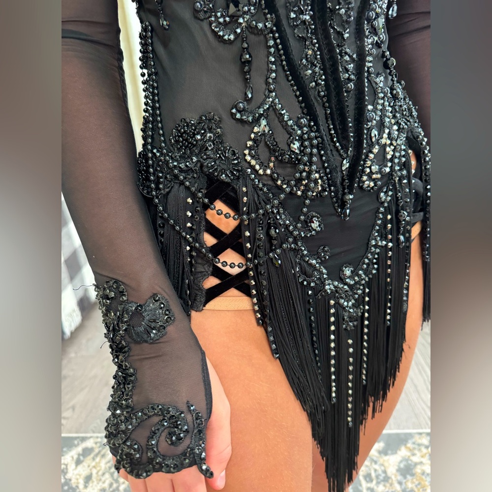 Black latin dress for dancing.Not new. But in very good condition!
